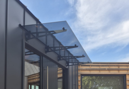 Glass Canopy Over the Building Entrance: Its Functions and Types